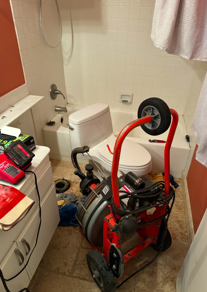 Professional drain cleaning machine used by Pure Planet Plumbing in a Burbank bathroom