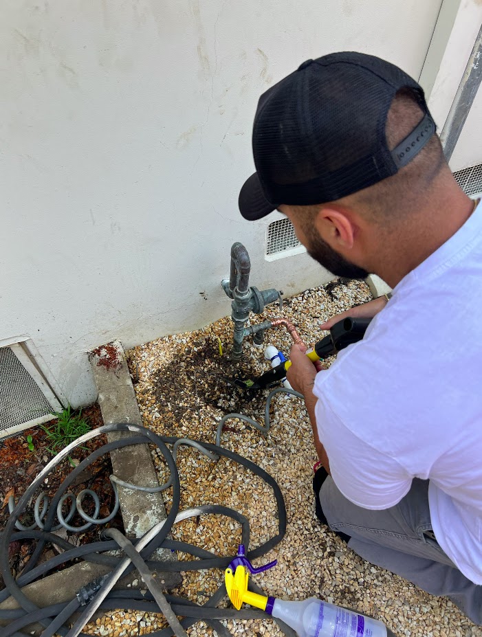 Pure Planet Plumbing technician working on an emergency plumbing repair in Burbank